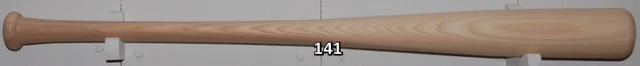 Wooden baseball bat on display.