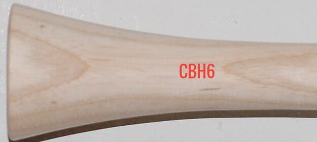 Wooden bat handle with red text, CBH6.